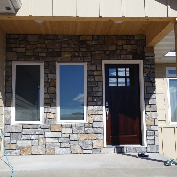 A custom front entrance will really set your home apart. This nearly finished entrance features side by side windows and a custom door.